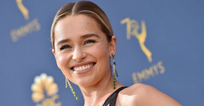 Emilia Clarke's reaction is perfect after mascot drops coffee cup and bends the knee