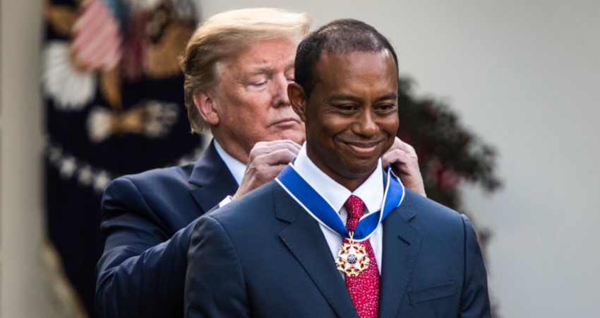 Tiger Woods weeps as he receives the Medal of Freedom from President Trump