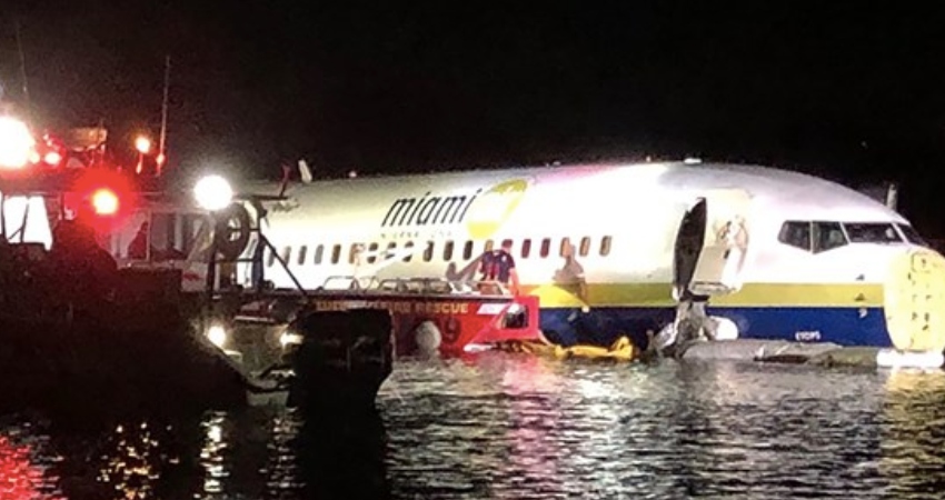 Plane with 143 people on board skids off runway and crashes into Florida river