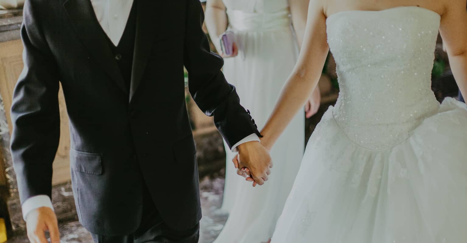 Couple called out after trespassing on rail lines to pose for wedding photos