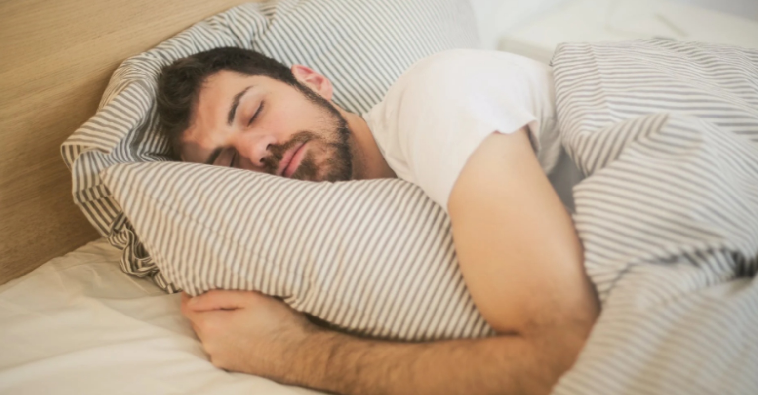 You can now buy a duvet with a hole in it so you can always sleep with one leg out