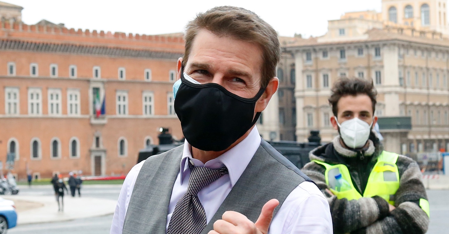 Tom Cruise wears two masks while greeting fans on set of 'Mission Impossible 7'