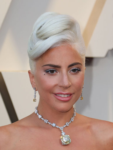 Woman who tried claiming $500k reward for returning Lady Gaga's stolen dogs is arrested by cops
