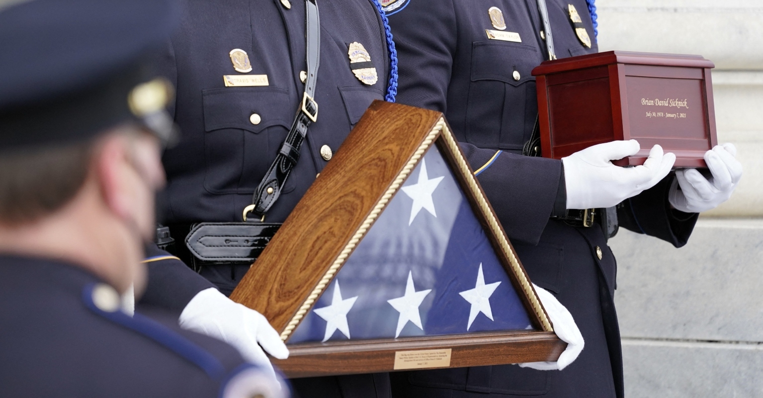Two men charged with assault in attack on Capitol police officer who died a day later