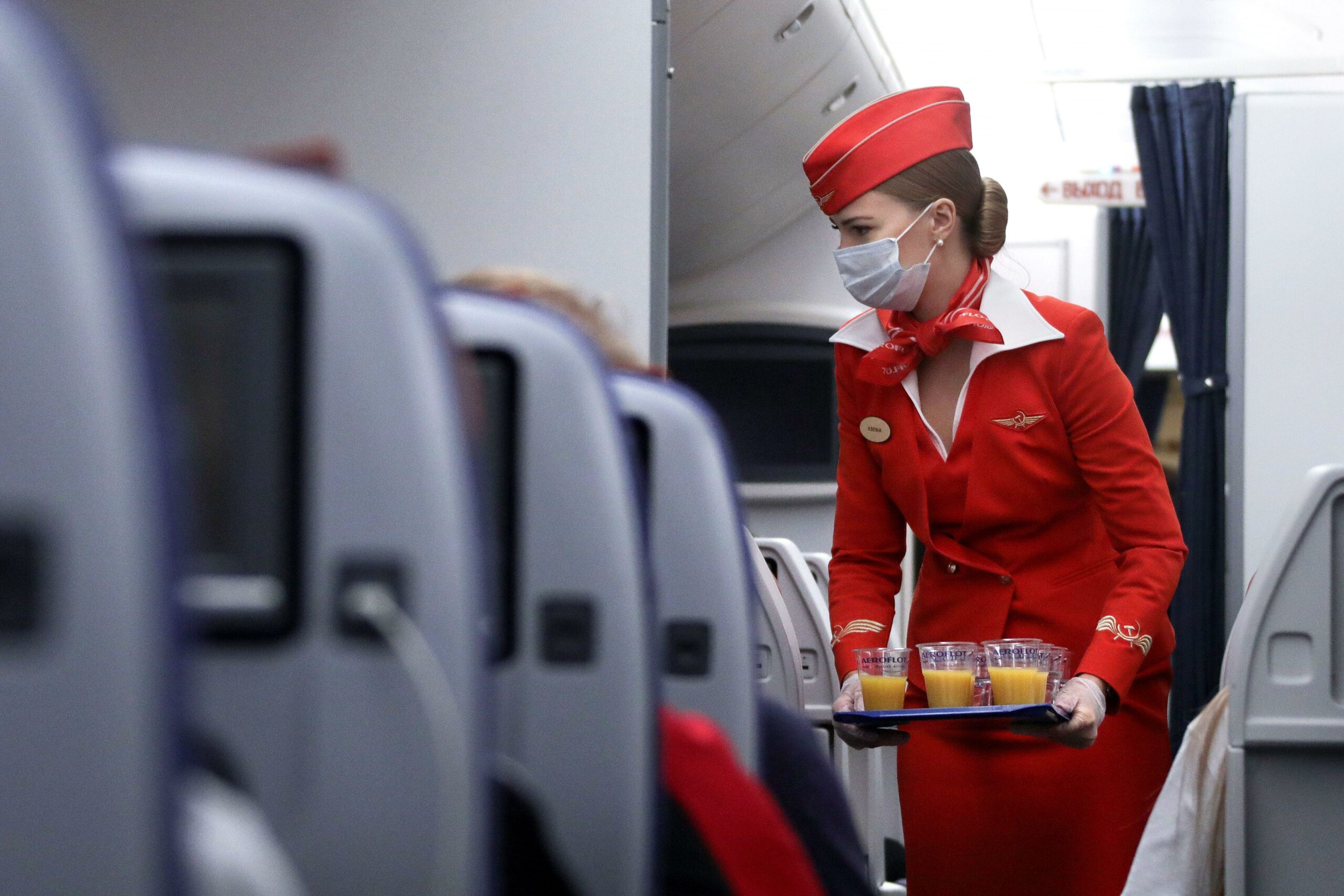 Flight attendant reveals what they're 'really doing' when they greet passengers on plane