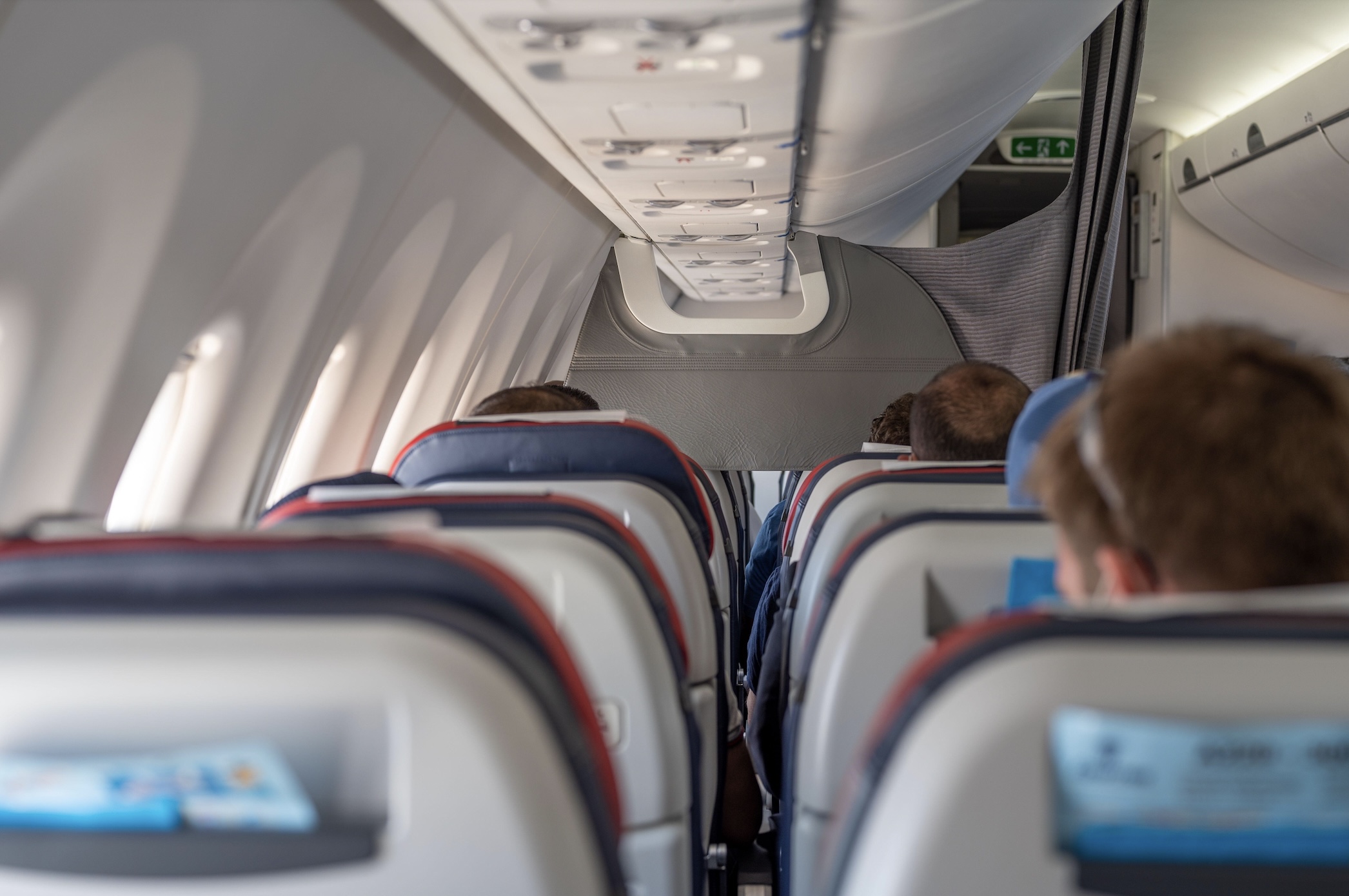 Passengers terrified as airplane's emergency exit door flies off moments before take-off