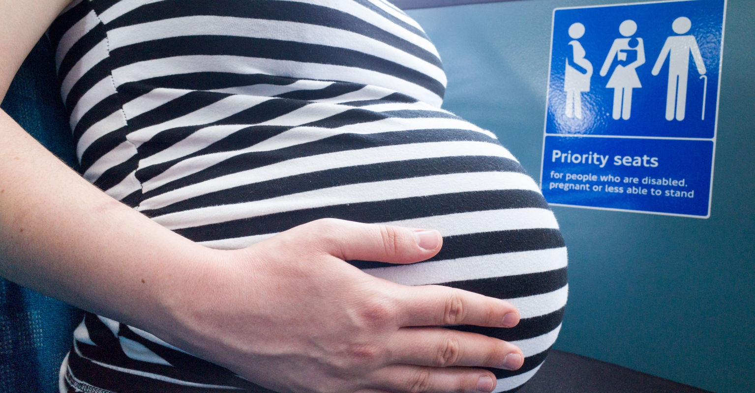Man refuses to give up bus seat for pregnant woman after working '10-hour shift', divides social media