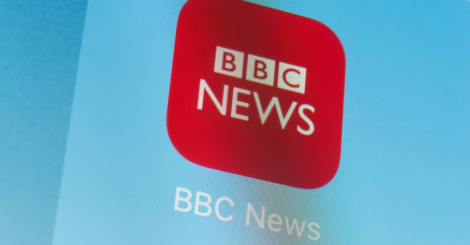 BBC news anchor is caught wearing shorts under the desk as viewers are left in hysterics