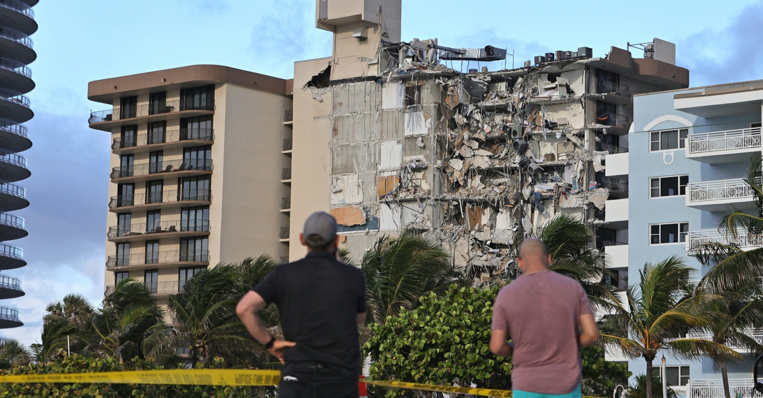 A boy's tiny fingers and helpless screams led a dog walker to discover him under Miami condo rubble