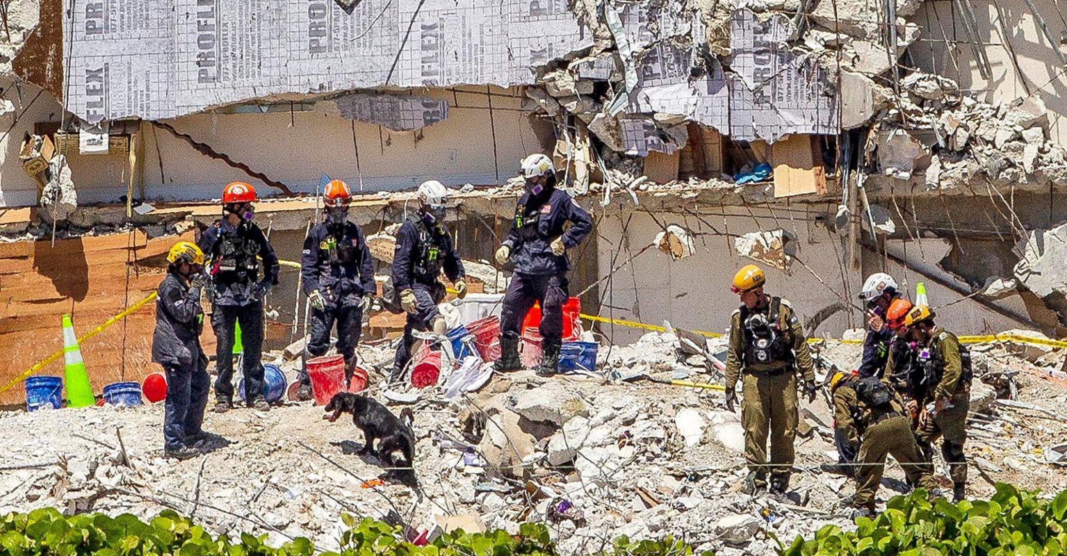 Remains of Miami condo demolished ahead of storm Elsa as death toll reaches 24