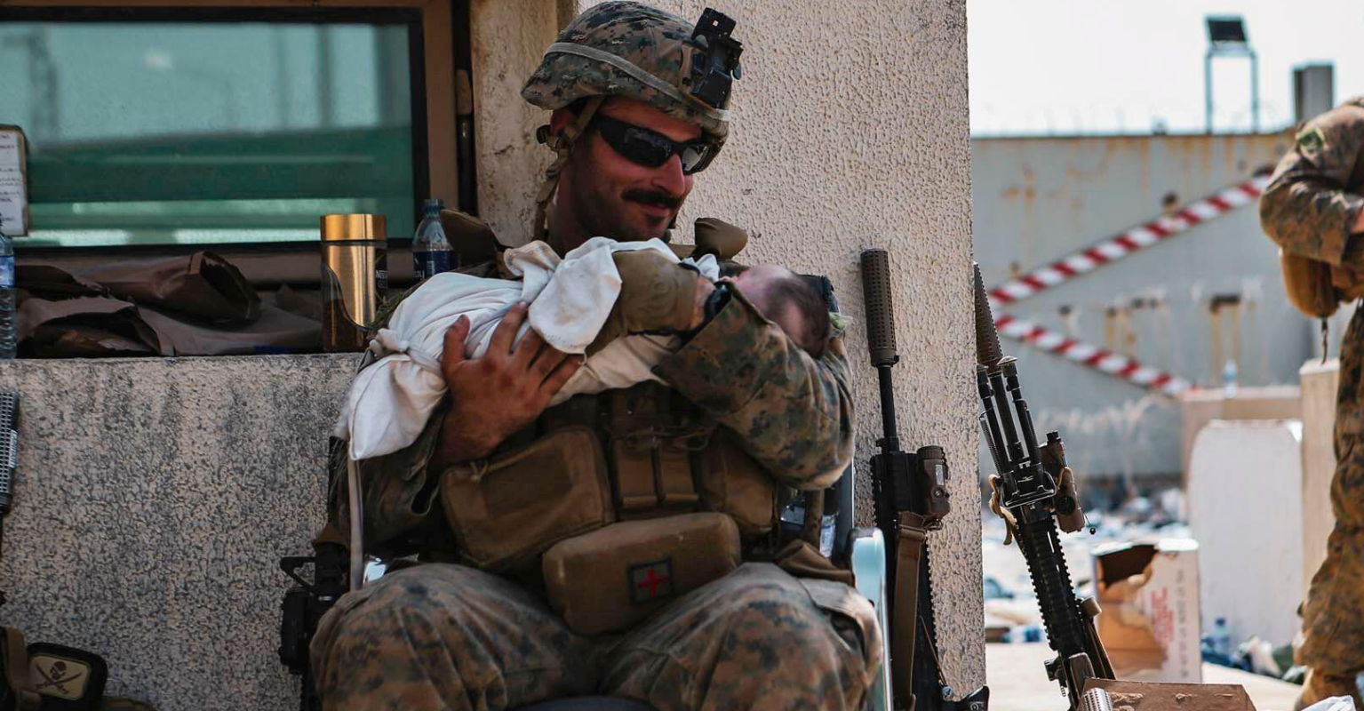 Powerful images show US military assisting Afghan children in Kabul