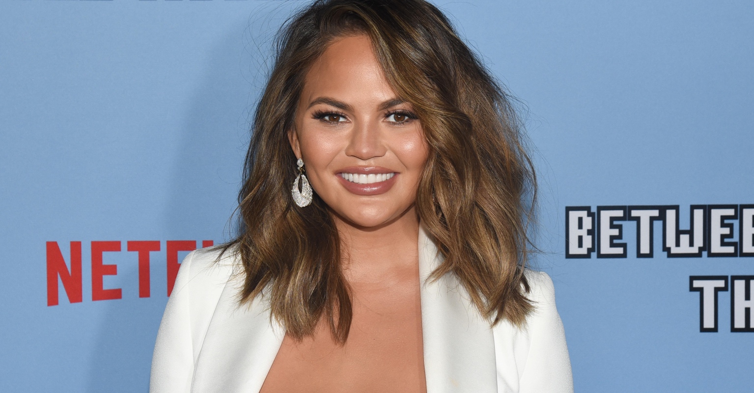 Chrissy Teigen says her kids insist on bringing late son's ashes with them when they travel as a family