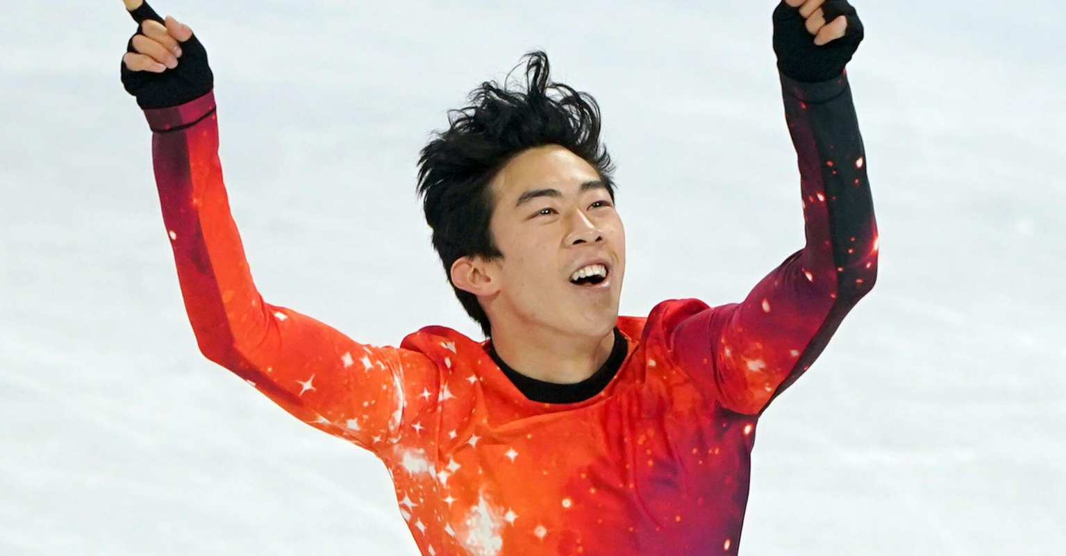 Nathan Chen places his Olympic gold medal around his mom's neck during surprise reunion