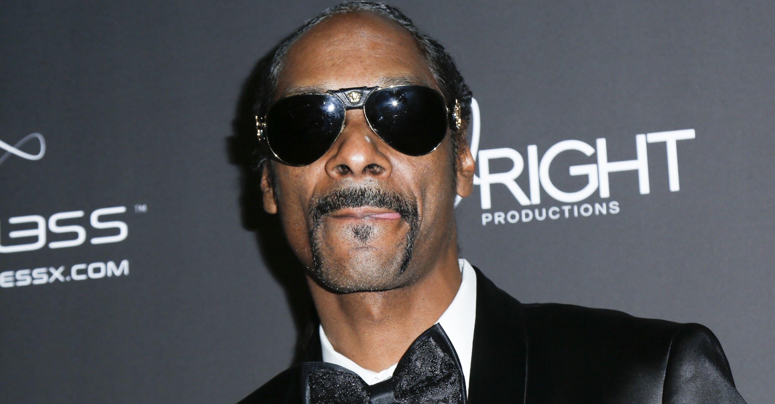 Couple gets engaged right in front of a baffled Snoop Dogg
