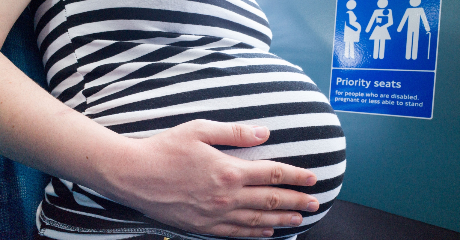 Pregnant woman asks if she was wrong to sit on a guy's hand after he refused to move it from empty bus seat