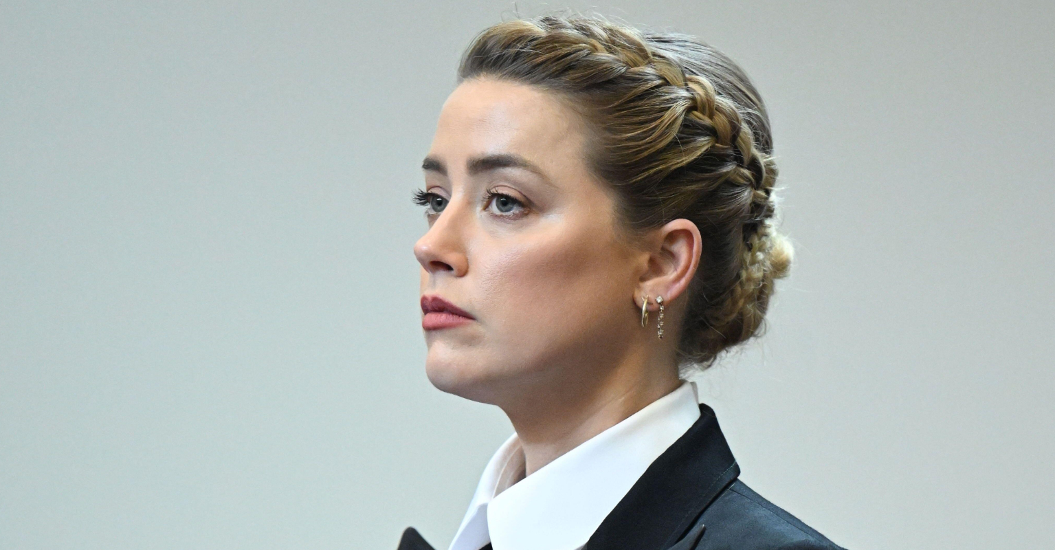 Video shows tense moment officials stop Johnny Depp from crossing Amber Heard's path