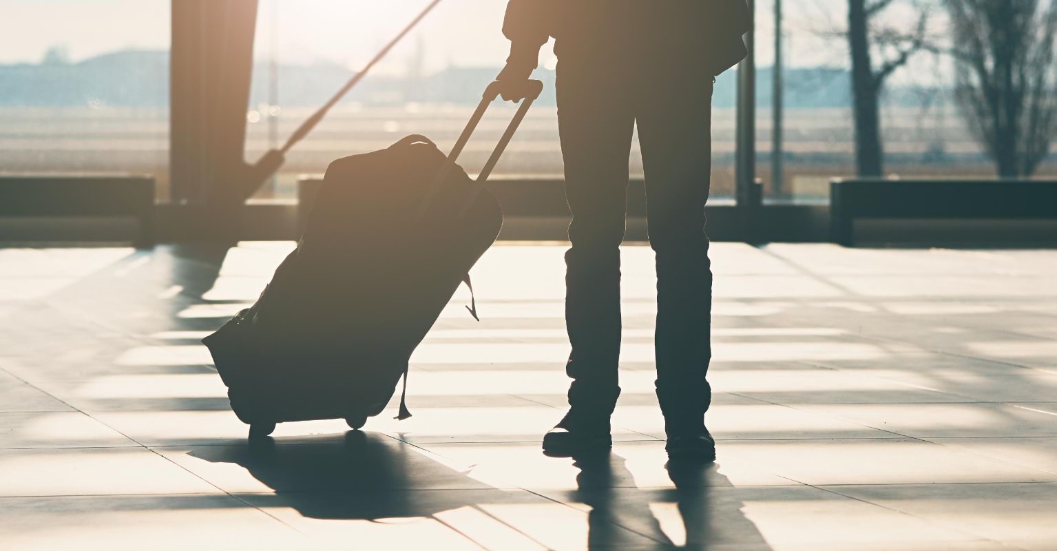 Woman divides internet after 'taking up enough space for 10 people' at busy airport