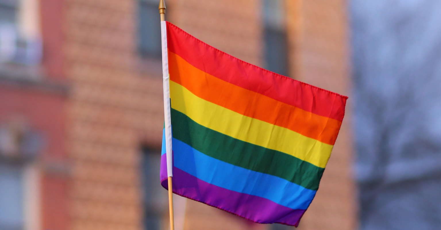 Grads protest anti-LGBTQ+ policy by handing over rainbow flag as they accept diploma