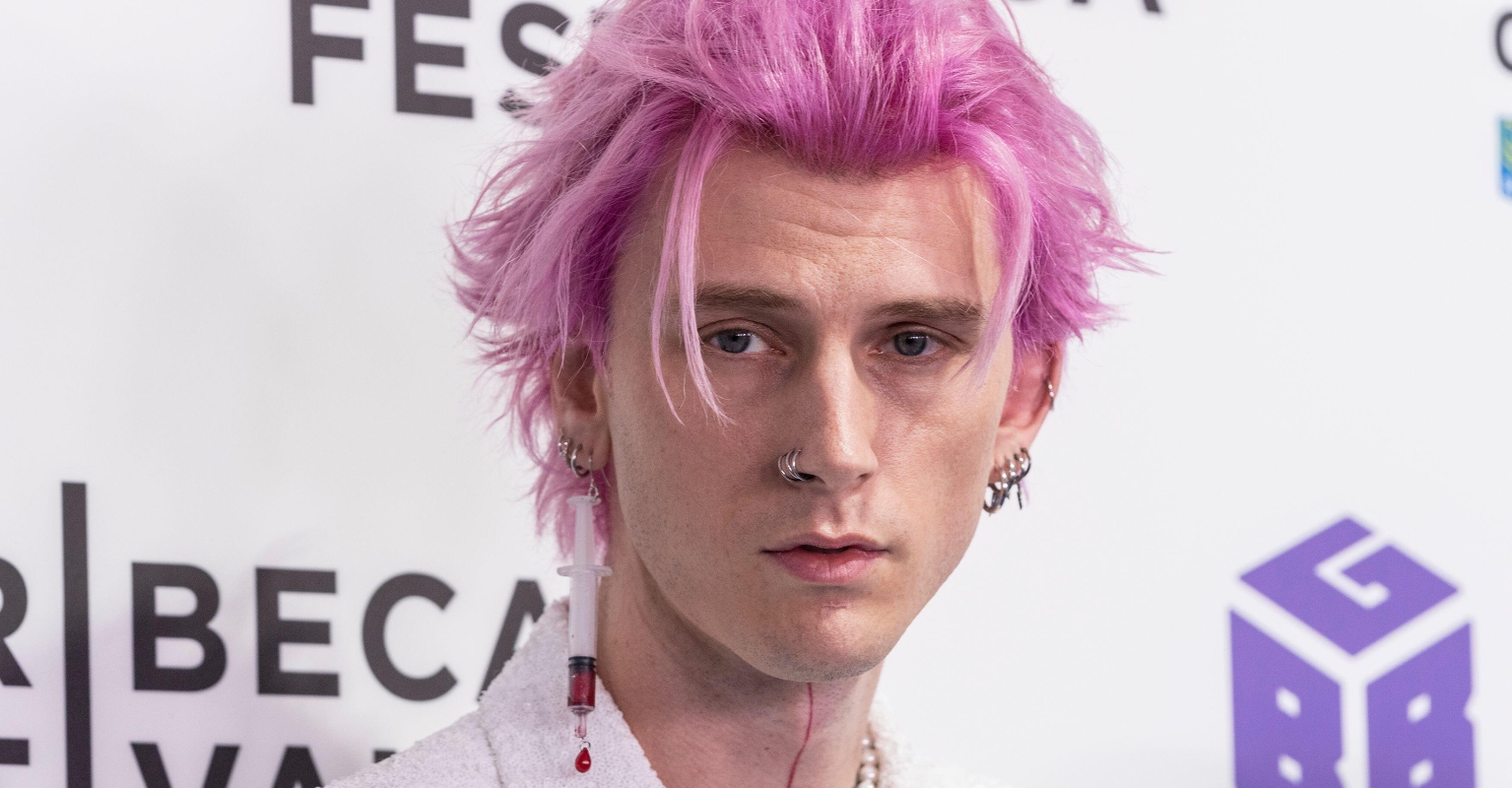 Machine Gun Kelly is slammed after attending premiere with 'syringe' earring