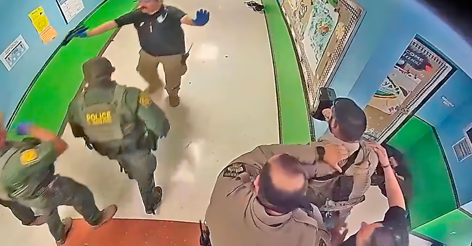 Uvalde surveillance footage shows moment sheriff's deputy and father of victim arrived in school hallway