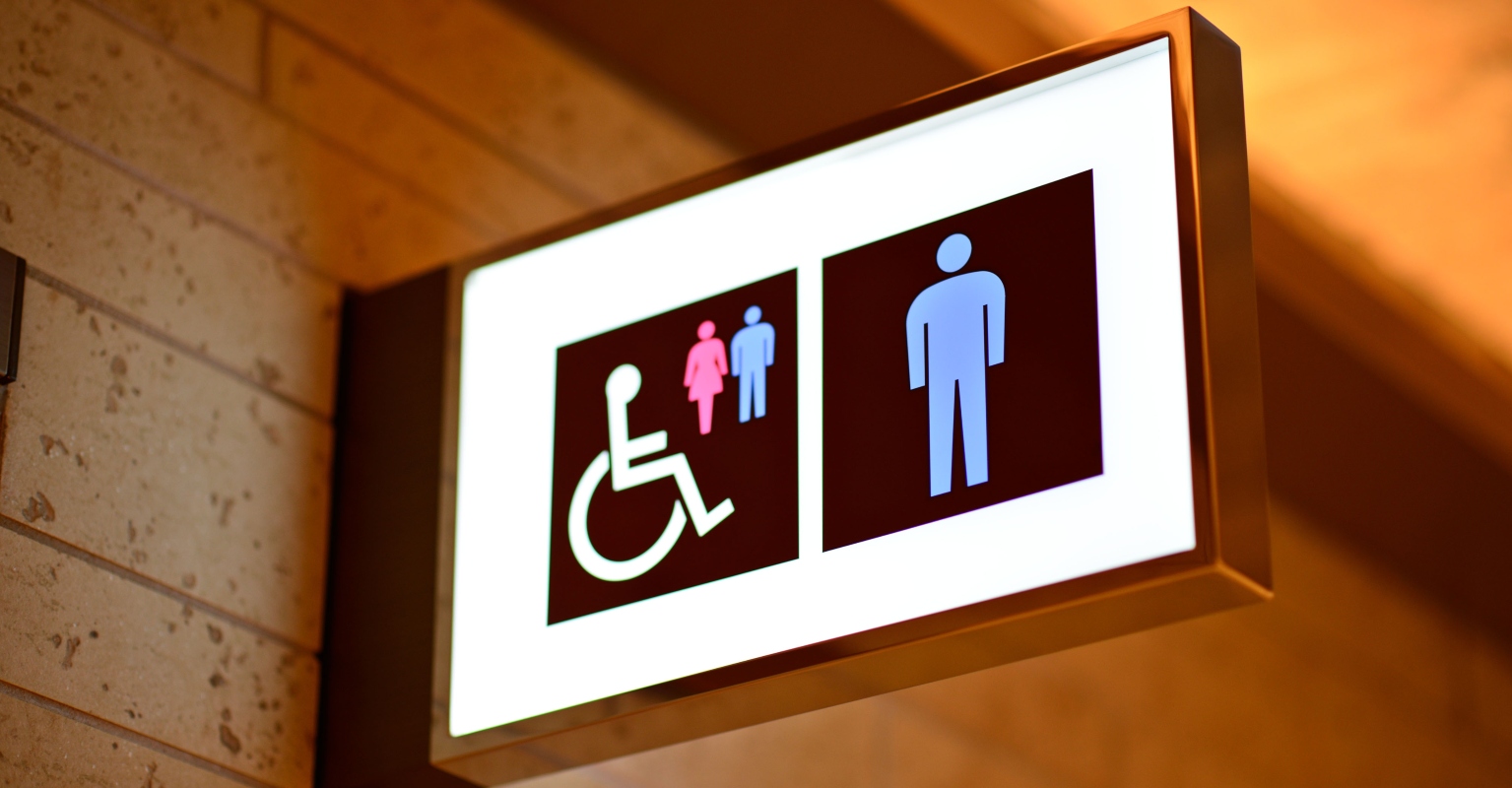 Guys kick women out of men's restroom after they didn't want to wait in line, sparking debate