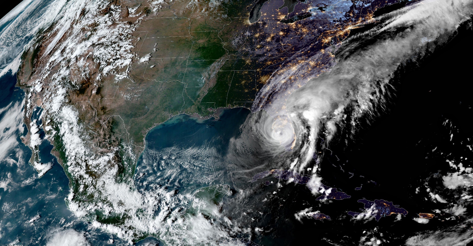 Man spotted running back to boat in an effort to save dog as Hurricane Ian batters Florida