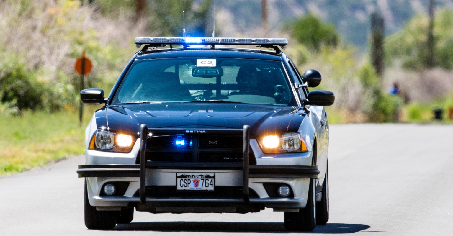 Police leave car with woman handcuffed inside moments before it's hit by train