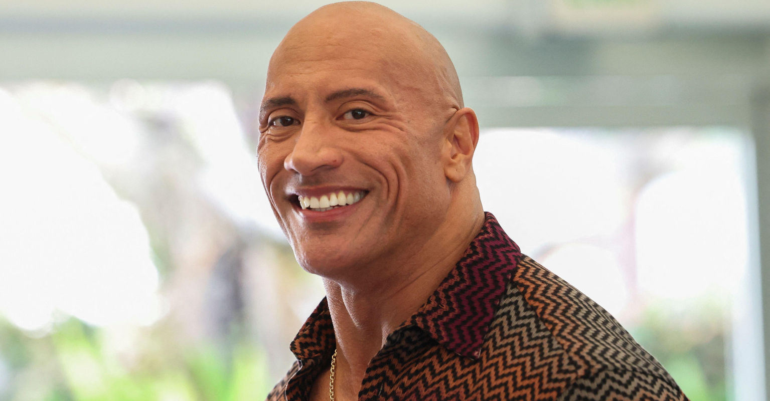 Dad crowd-surfs his baby to Dwayne 'The Rock' Johnson in surreal footage