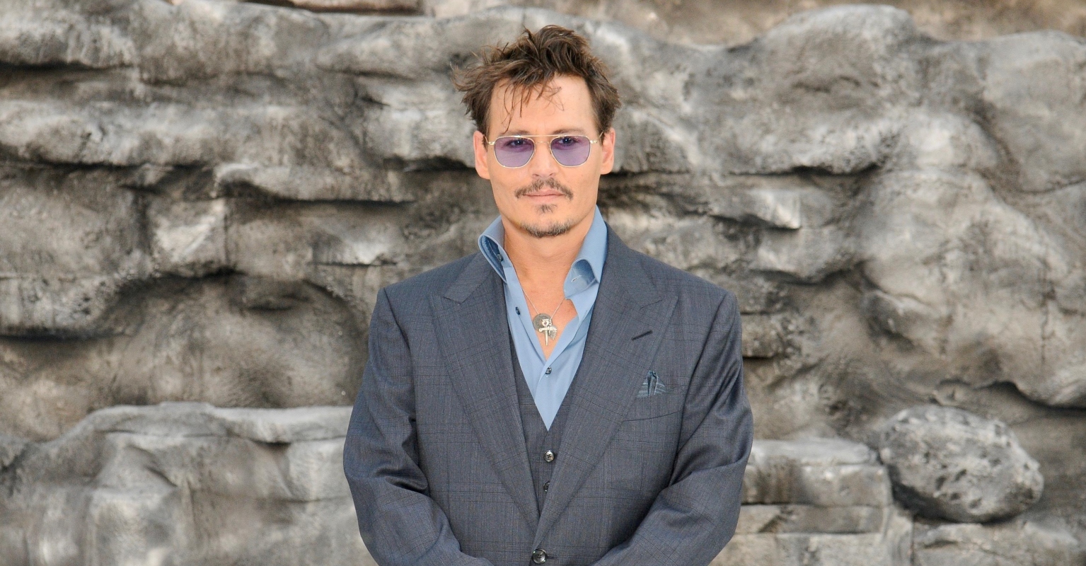 Johnny Depp appears in Rihanna's fashion show as people call for boycott