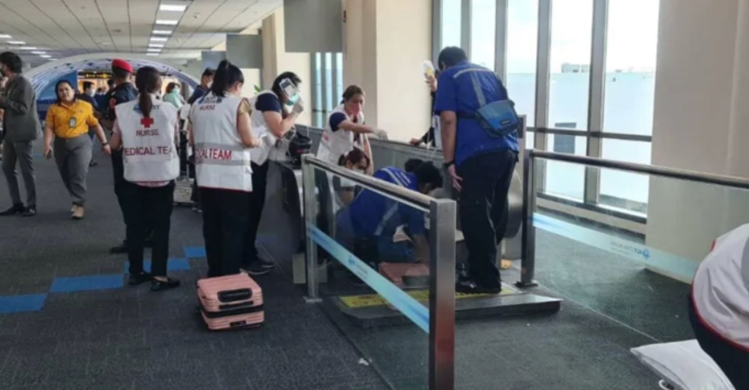 Woman's leg amputated at airport after becoming trapped in moving walkway