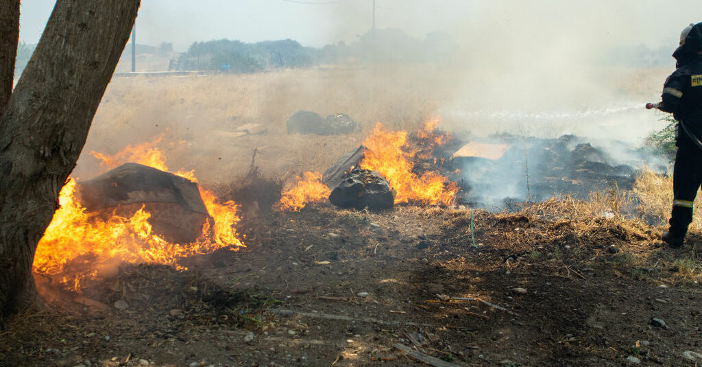 Tens of thousands of tourists evacuated from Greek vacation hotspot as fires ravage Rhodes